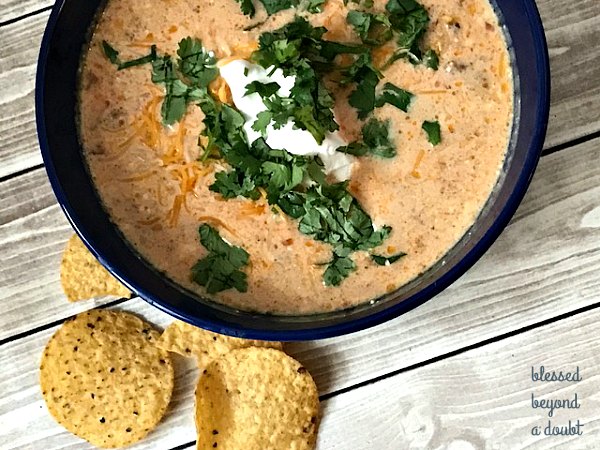Try this delicious easy slow cooker taco soup with a twist. Check out the secret ingredient. You will want to add this to your list of easy cheap crockpot meals.