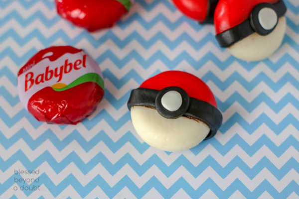 Be the the cool mom on the block and make these easy DIY Pokeball cheese snacks. #pikachu #DIY #snacks